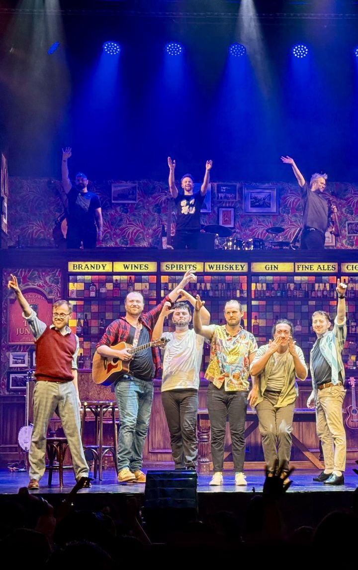 The Choir of Man cast and band taking a bow on stage during the China tour