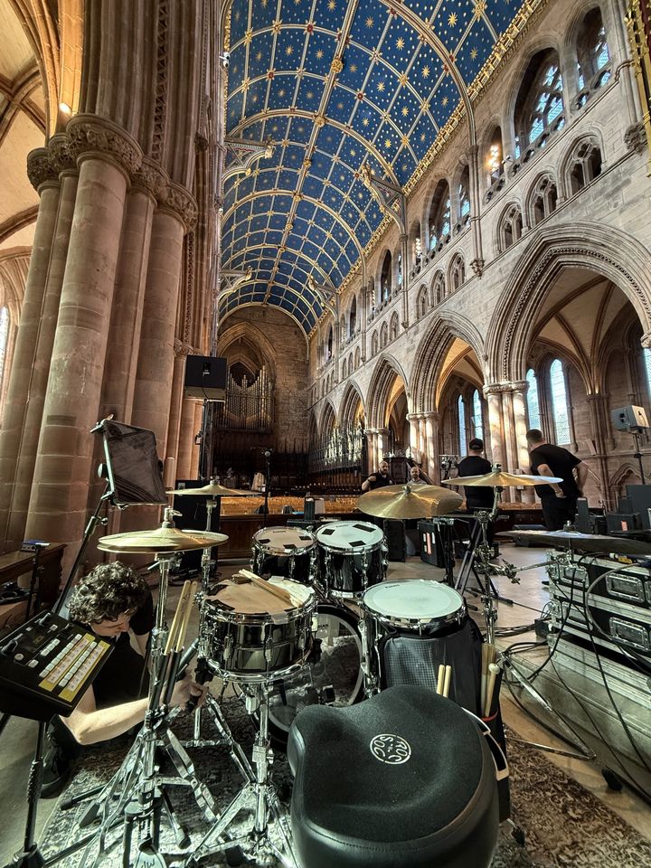 Kit set up beneath a painted cathedral ceiling