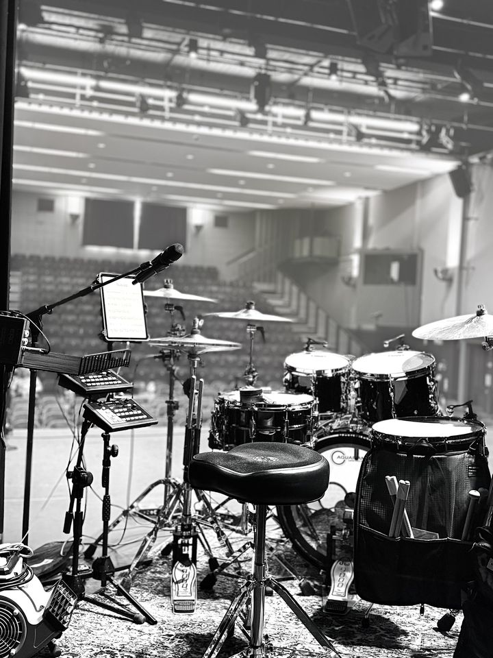 Black and white shot of the kit set up in an empty concert hall